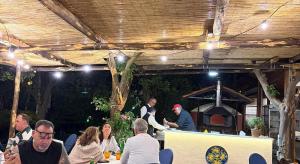 a group of people sitting at a table in a restaurant at Villa Massa Residence in Sant'Agnello +31 photos