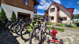 a group of bikes parked in front of a house at Нота Карпат in Skole