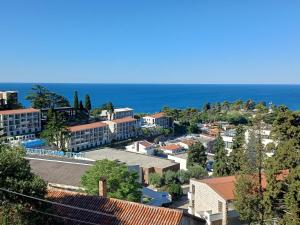 a view of a city with the ocean in the background at Tina Rooms in Ulcinj