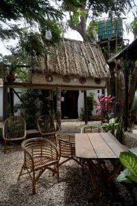 a table and chairs in front of a building at Saldomar B&Biosphere in Bubaque