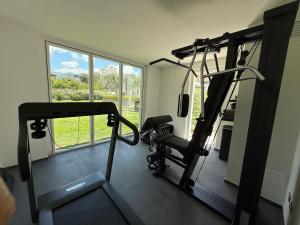 a room with a gym with a treadmill and a window at Villa Massa Residence in Sant'Agnello