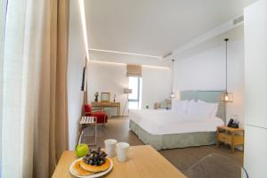 Postel nebo postele na pokoji v ubytování NLH FIX | Neighborhood Lifestyle Hotels