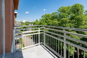 a balcony with a view of a street at Apartament Piastowska Elite in Gdańsk +6 photos