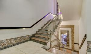 a set of stairs in a building with a stair case at FabHotel CSFC in Bhopal