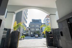 an archway with a car parked in a parking lot at Luxury Apartment Da Giovanni in Caserta