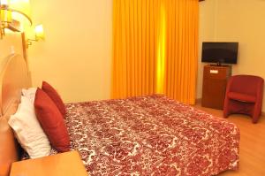 Cama ou camas em um quarto em Hotel Solneve