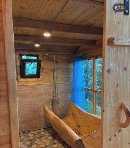 a large wooden tub in a room with a tv at JUSA ჯუსა in Kantauri