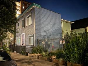 a house with a fence in front of it at Vancouver east downtown queen bed room share bathroom in Vancouver