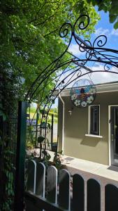 a building with a fence and a wrought at The Green Room in Killarney