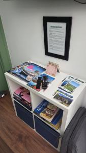 a white desk with books on top of it at The Green Room in Killarney +23 photos