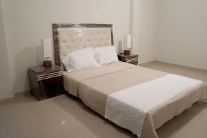 Un pat sau paturi într-o cameră la Casa del Inka Perú