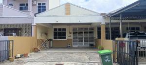 a house with a gate and a garage at Aisyhome in Jitra