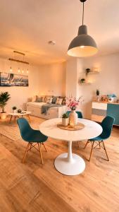 a living room with a table and chairs at Family nest Medulin- apartment with private parking and jacuzzi in Medulin
