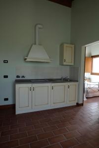 Kuchyň nebo kuchyňský kout v ubytování Corte Stellata Holiday Apartments