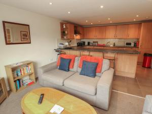 a living room with a couch and a table at Valley View in Cleator Moor