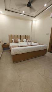 a bedroom with a large bed in a room at SS Residency in Gorakhpur