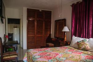 Postelja oz. postelje v sobi nastanitve Firefly Beach Cottages