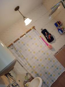 a crib in a bathroom with a light on top at Karnai Residency in Srinagar +29 photos