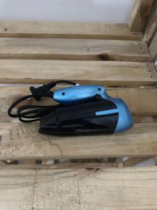 a blue and black object sitting on a wooden floor at Kipe House Nungwi in Nungwi