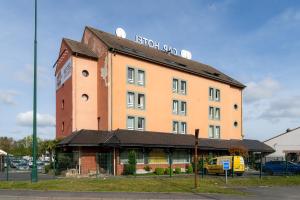 a building with a sign on the top of it at Logis Hôtel & Restaurant Cap Hôtel in Noyelles-Godault