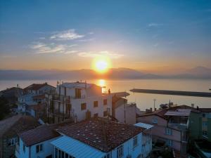 a view of the sunset over a city at Fulya Pension in Egirdir