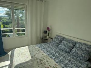 a bedroom with a bed and a window at wonderful sea view in Antibes +81 photos