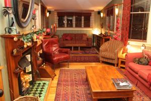 a living room with a couch and a table at Villa Rouge B&B in Invercargill