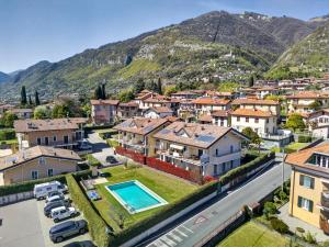 an aerial view of a small town with a mountain at Duplex with terrace , pool, 2 bedrooms in Lenno