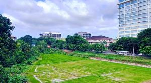 a large grass field in a city with buildings at Studio Greenlands 2nd-E in Battaramulla