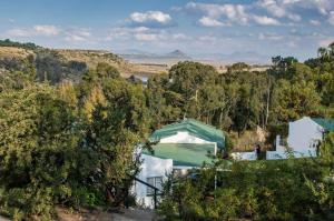 a view of a house with a green tent at Petronella Guest House in Bethlehem