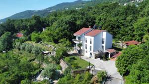 an aerial view of a house in the mountains at Apartmani ViVa in Lovran