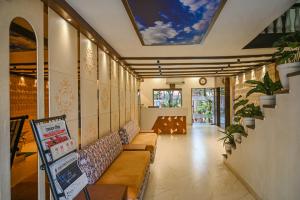 a lobby with couches and a skylight at Hotel Jaisingh Palace in Jaipur