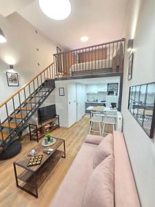 a living room with a couch and a table at Homey Edessa Loft in Edessa