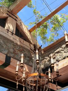 a chandelier hanging from a wooden ceiling at Dali GuGu Hotel in Dali Ancient Town
