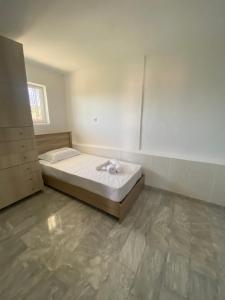 a bedroom with a bed in a room at Selinia Apartments in Selínia