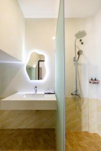 a bathroom with a sink and a shower at AuraLite Hotel - Panorama View Đà Lạt in Da Lat +89 photos