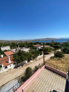 a view from the balcony of a house with a road at Selinia Apartments in Selínia