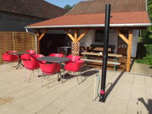 a gazebo with tables and chairs on a patio at Remser Haus in Zalakaros