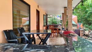 a dining room with a table and chairs at SPATHODEA in Vagamon