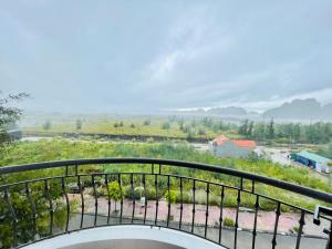 a view from the balcony of a house at Khách sạn Cao Sơn in Cửa Ông