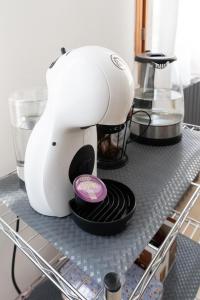a white mixer sitting on top of a shelf at Enza House in Chioggia