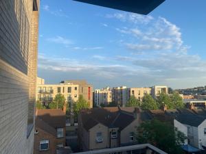 a view of a city with buildings and houses at Colindale Central Apartment in Colindale