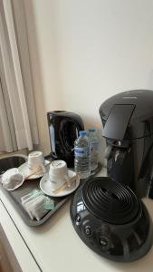 a coffee maker sitting on top of a counter at Lisboa II Hotel Restaurant in Luxembourg