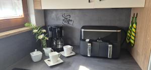a kitchen with a coffeemaker and a coffee maker at Haus Neubauer in Giengen an der Brenz