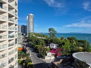 an aerial view of a city with a tall building at Royal Beach View in Pattaya South