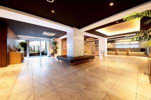 an empty lobby with a large room with a large tile floor at Hotel Asia Center of Japan in Tokyo