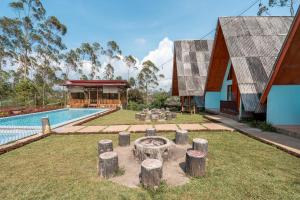 a house with a garden and a swimming pool at The Cabin Artana By ARBA in Palayangan +31 photos