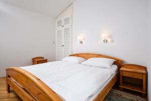 Postel nebo postele na pokoji v ubytování Apartmani Alice