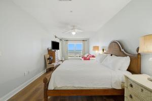 a bedroom with a large bed and a window at Riviera Dunes 201 in Perdido Key +47 photos