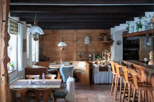 a kitchen and dining room with a table and chairs at Hotel in der Mühle in Werdau